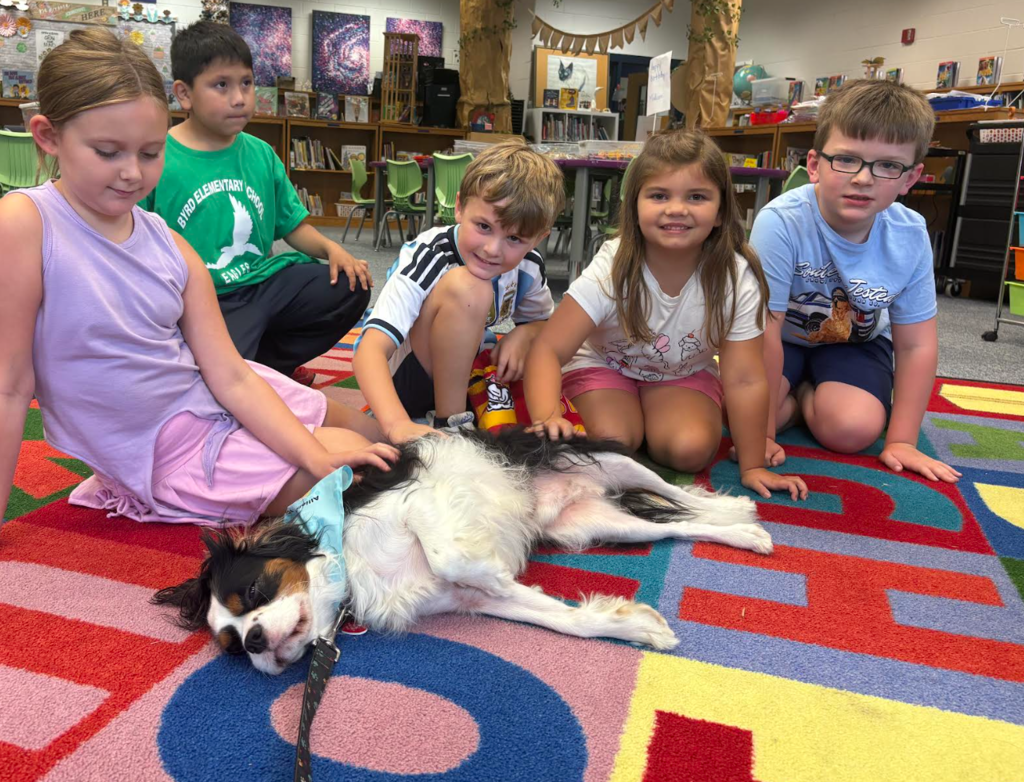 Students loved to pet Dawson while they listened to stories