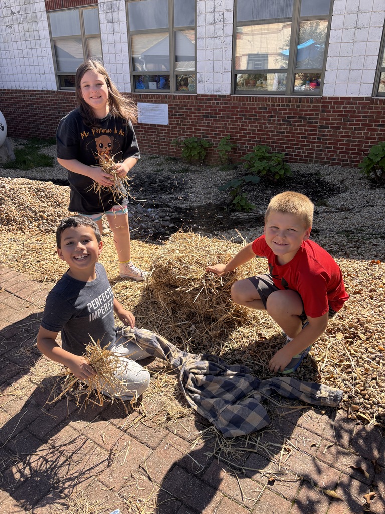 Students using hay donated from Southern States