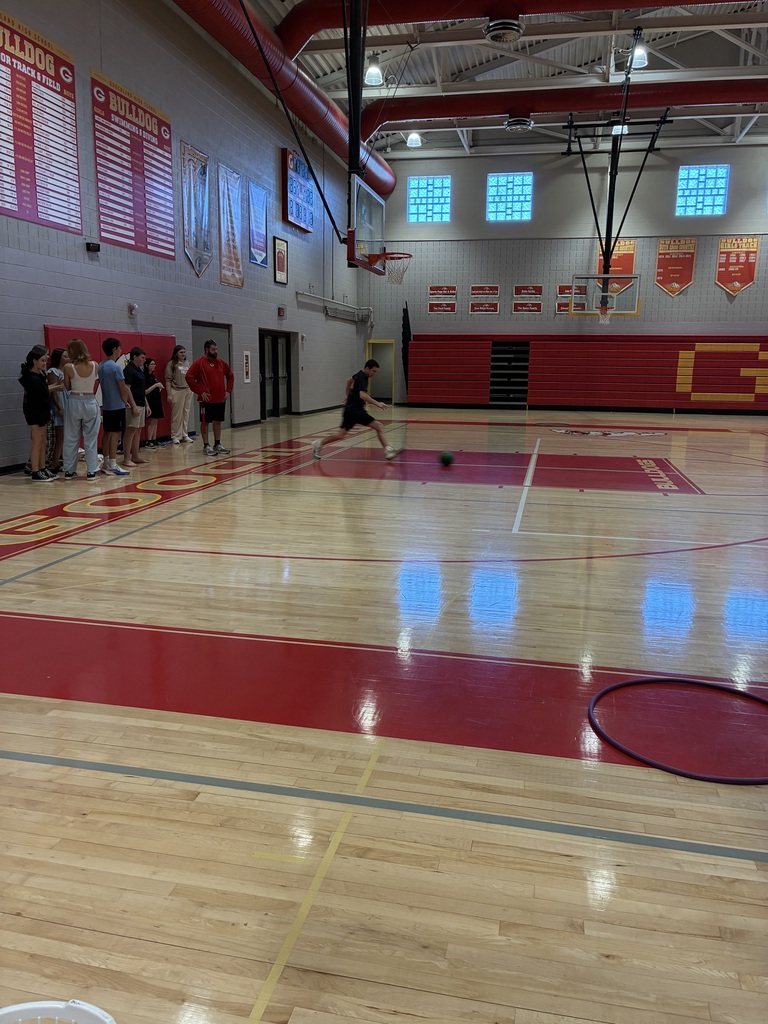 Student kicking ball