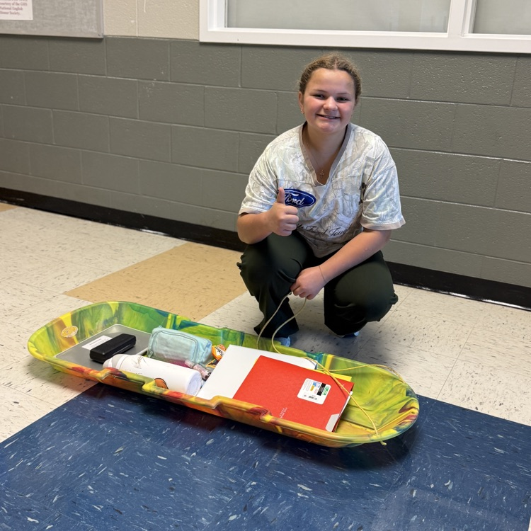 student with sled 