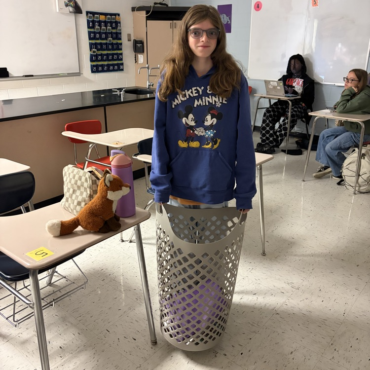 student with laundry basket