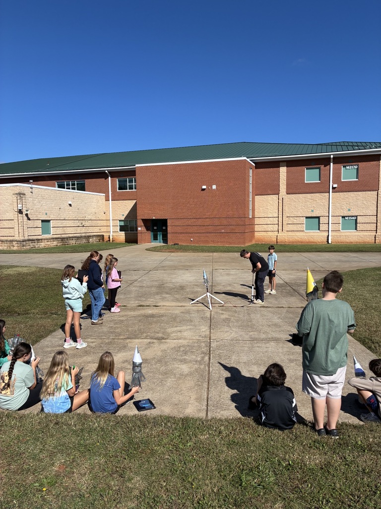 Students shooting off bottle rockets