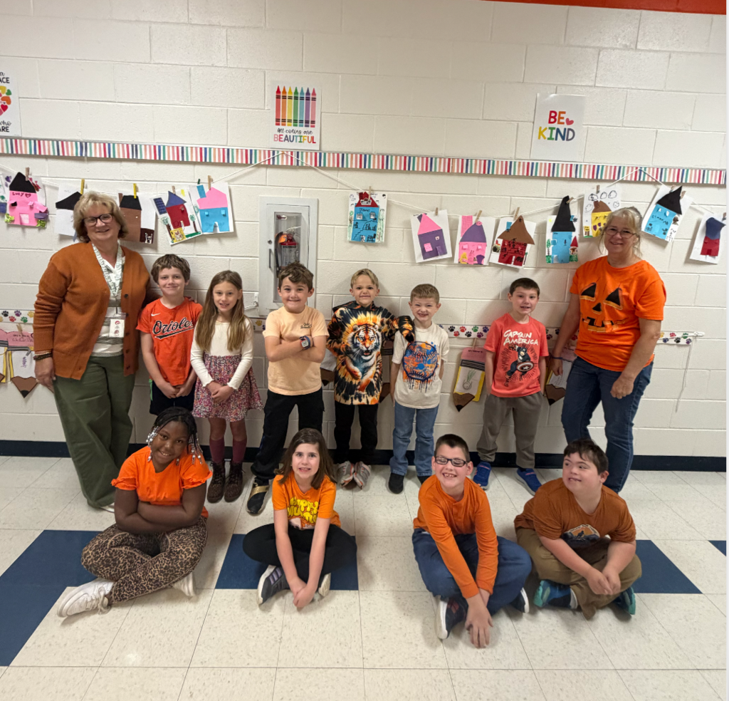 Teachers and their class wearing orange for Unity Day.