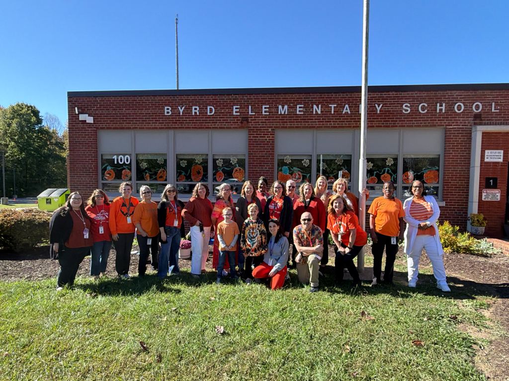 A picture of our faculty and staff wearing orange for Unity Day.