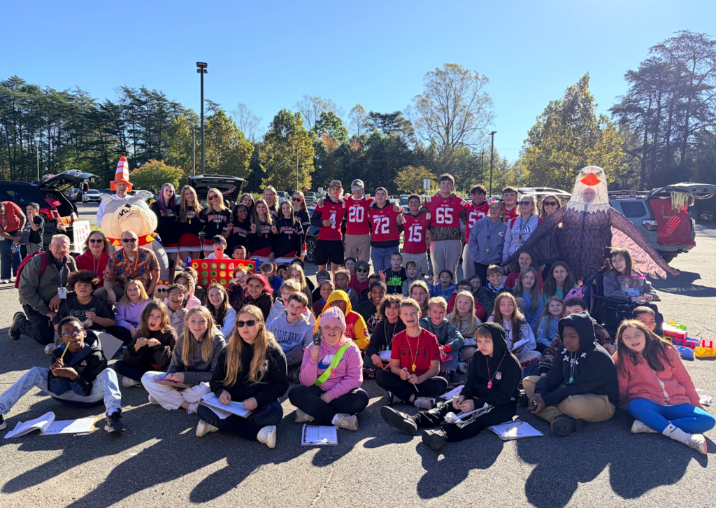 Group picture of high school and elementary students.