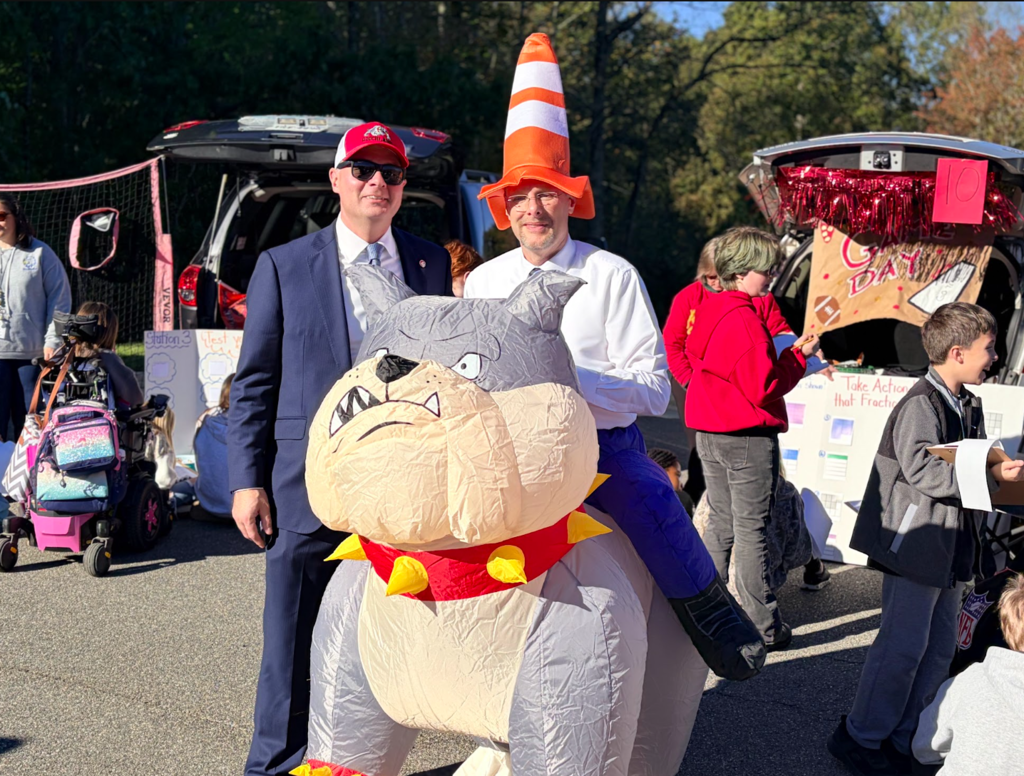 Our school superintendent with a teacher dressed up as a bulldog
