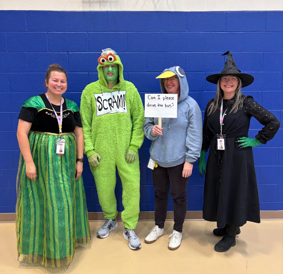 Four teachers dressed up.