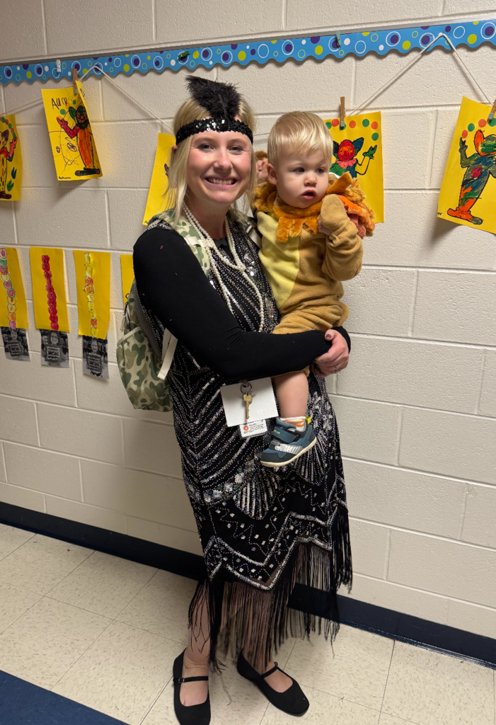 A teacher and her baby dressed up for halloween.