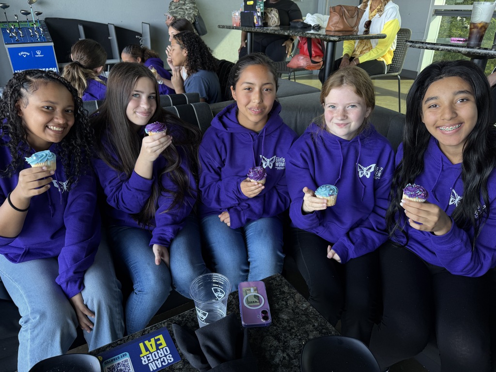 Girls2Women group photo at Top Golf