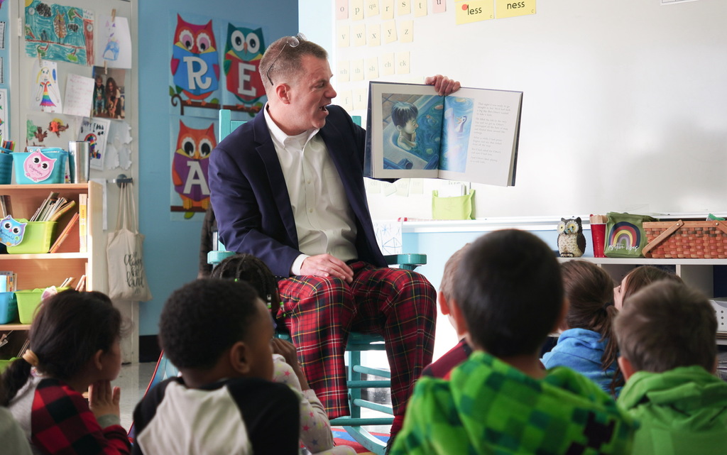 Dr. Geyer reading to students