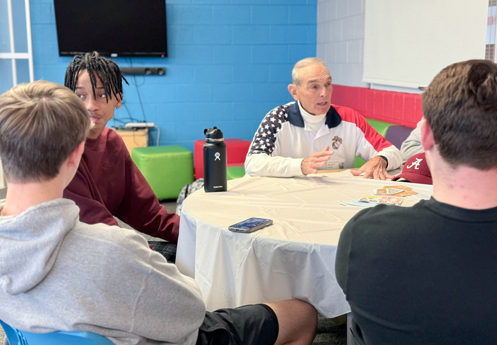 Students listening to a veteran