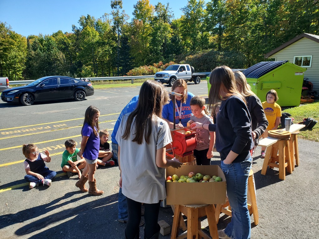 Students enjoying the fresh cider