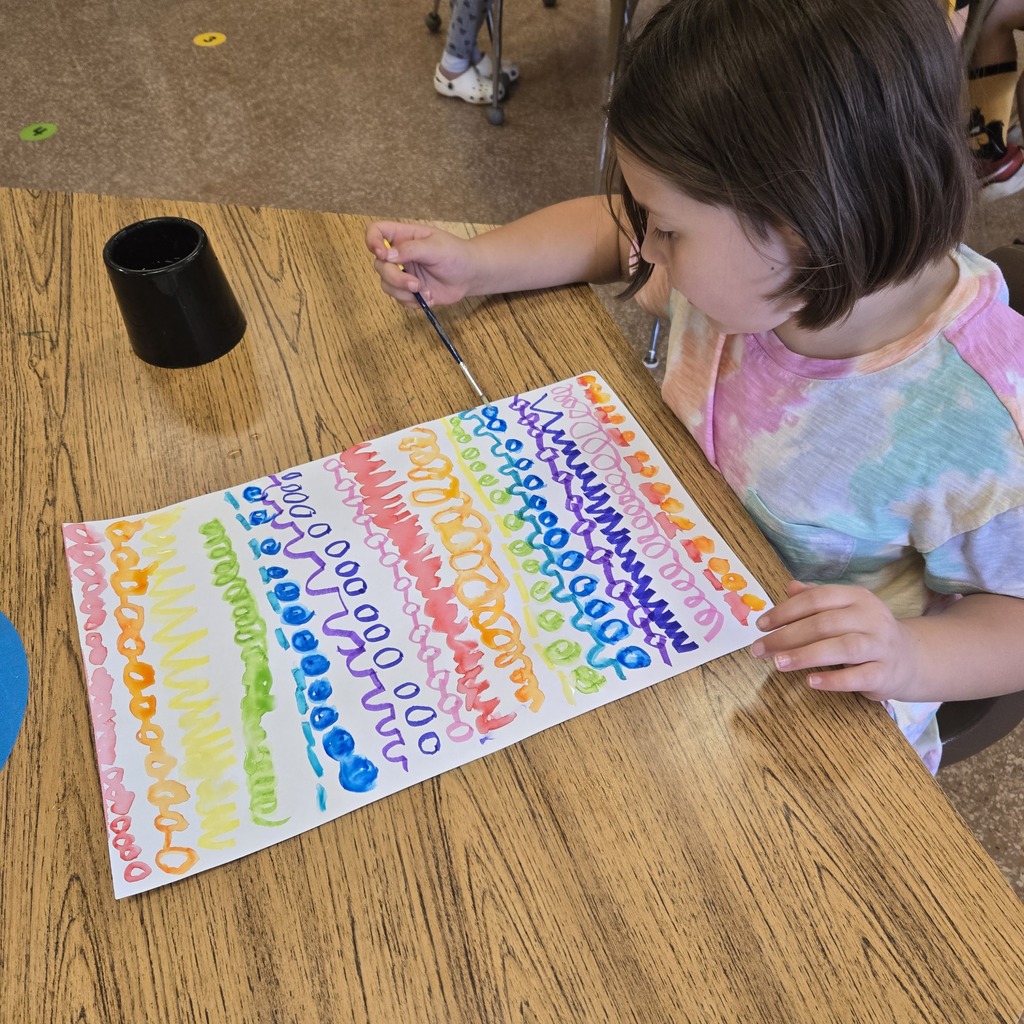 Practicing our lines in art class with markers and water