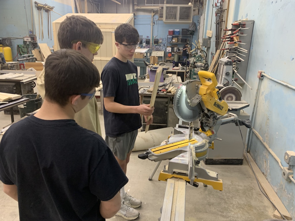 Students cutting angles on boards