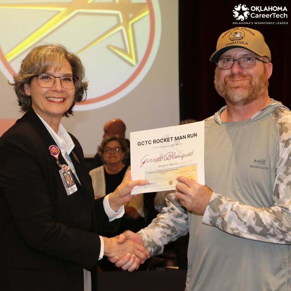 GCTC student present with certificate at awards assembly.