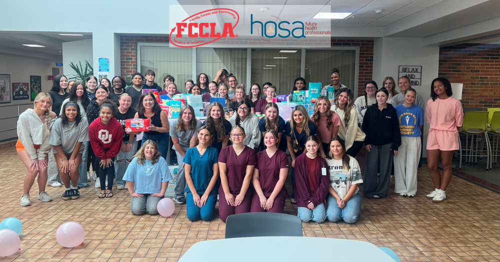 GCTC students pose with diapers collected for Legacy Parenting Center