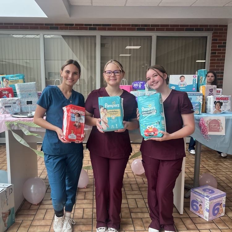 FCCLA and HOSA students pose with diapers collected for Legacy Parenting Center