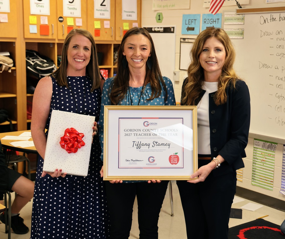 Tiffany Stamey, District Teacher of the Year Finalist, being recognized with Superintendent Alice Mashburn and Principal Kelly Rampy