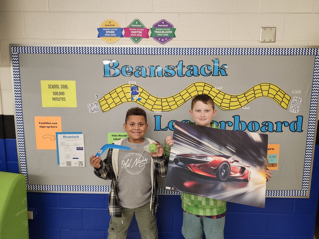 r Beanstack Challenge winners, Kayce Woodard and Jaxtyn Patton standing with prizes