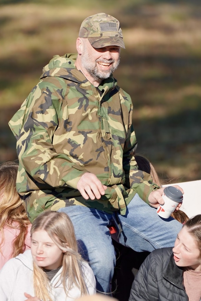 A veteran wearing a camouflage army jacket.