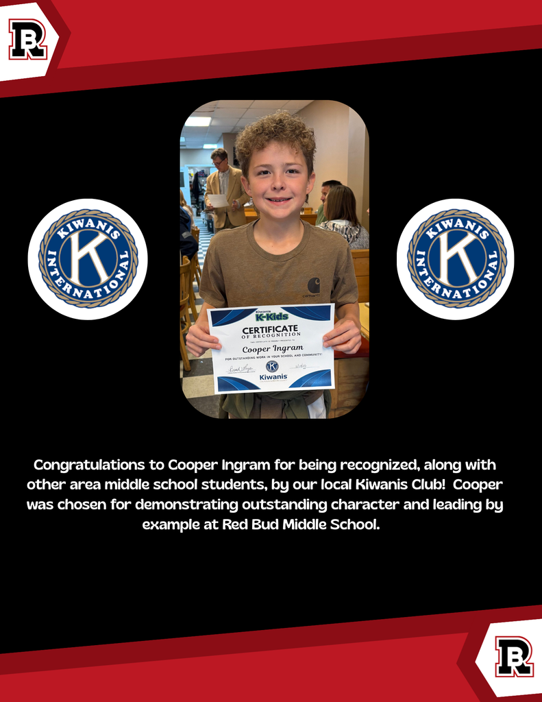 A boy is holding an award certificate for demonstrating outstanding character.