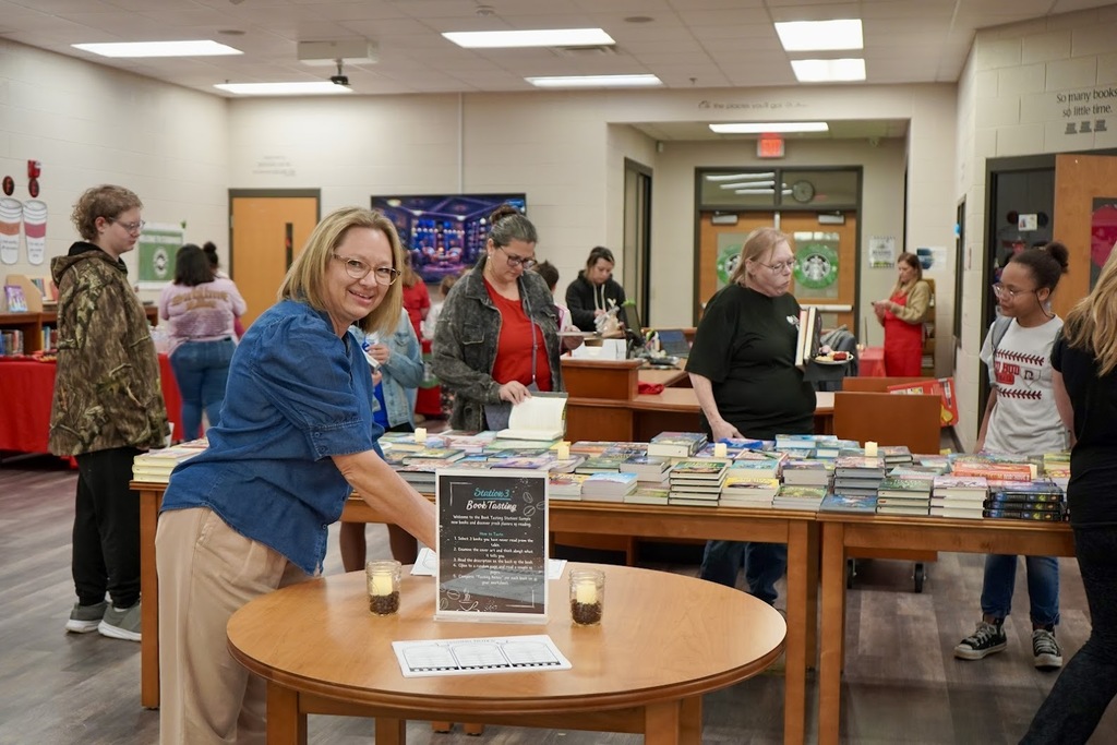Students a parents perusing the table of free books.