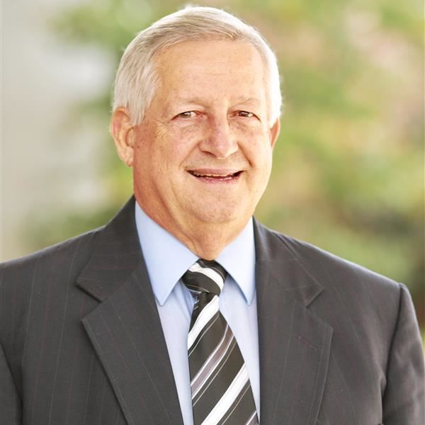 Mr. Bobby Hall in a suit and tie.