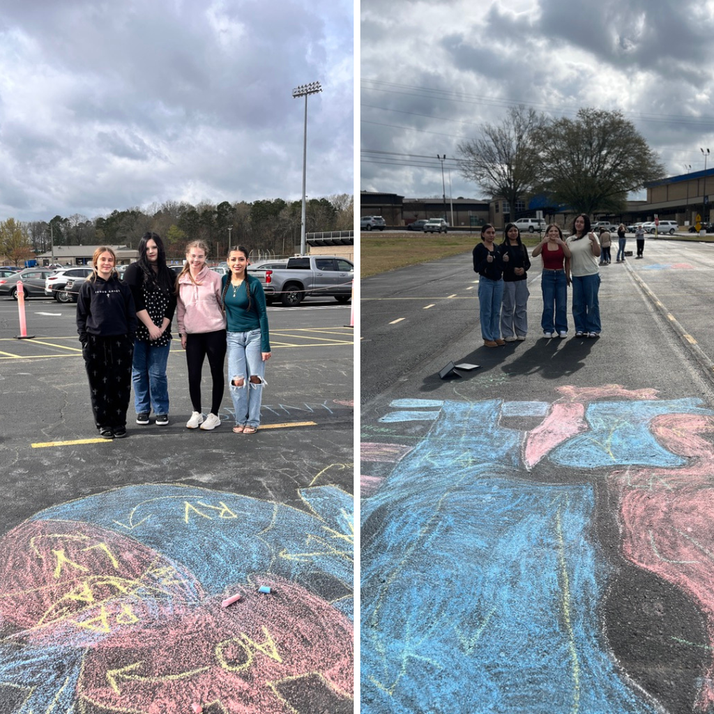 Allied Health students diagramming the heart with chalk in the school parking lot. 