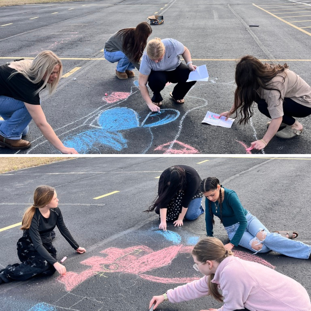 Allied Health students diagramming the heart with chalk in the school parking lot. 