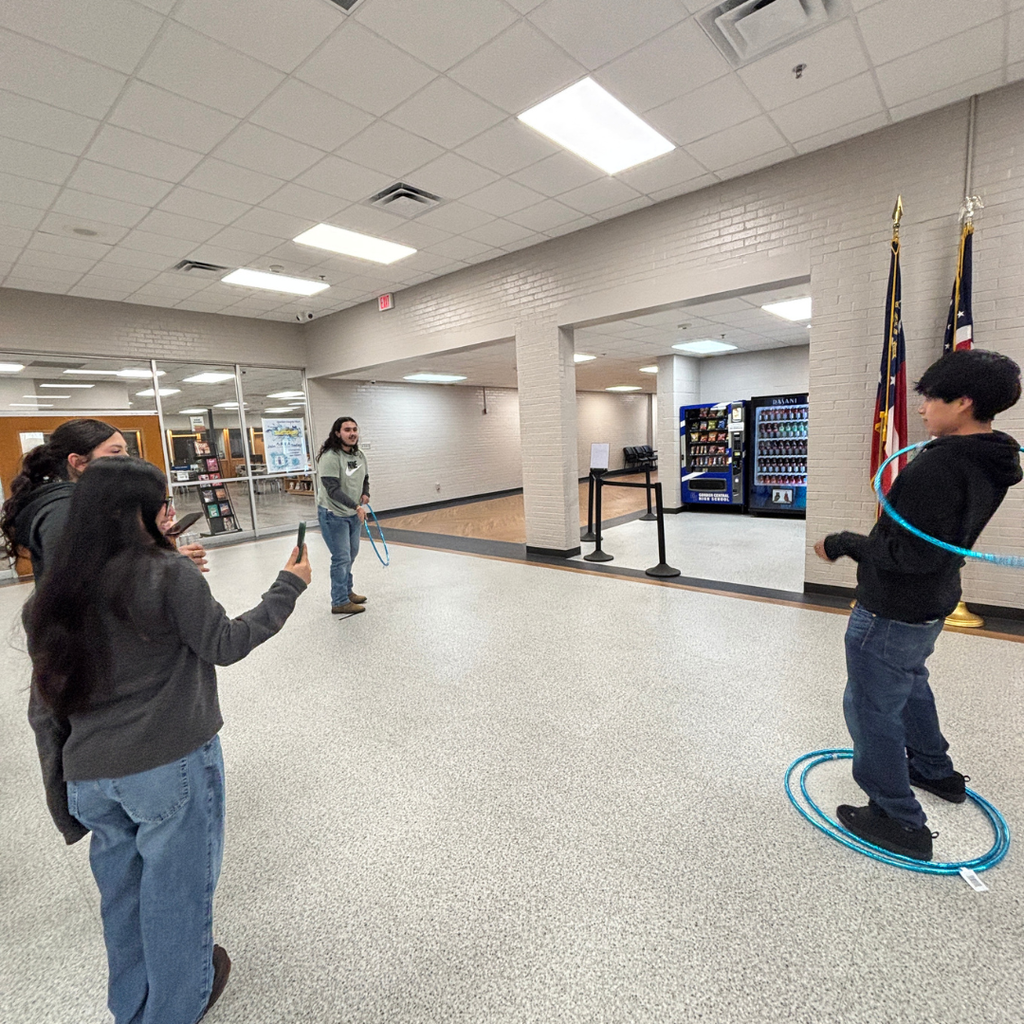 Students competing in Hula Hoop Toss for Homeroom March Madness Games