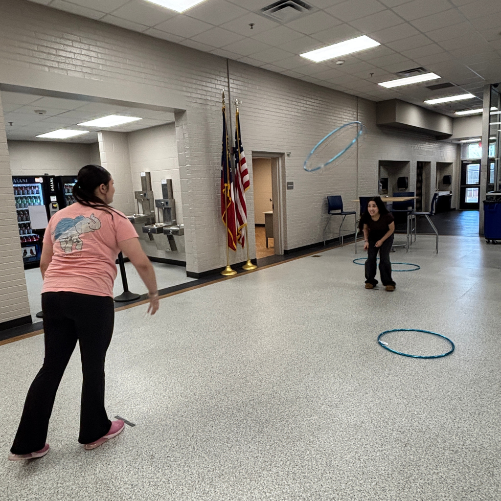Students competing in Hula Hoop Toss for Homeroom March Madness Games