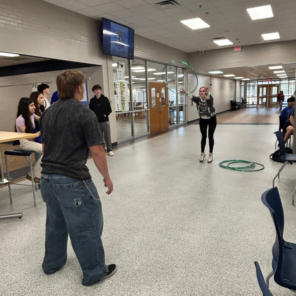 Students competing in Hula Hoop Toss for Homeroom March Madness Games