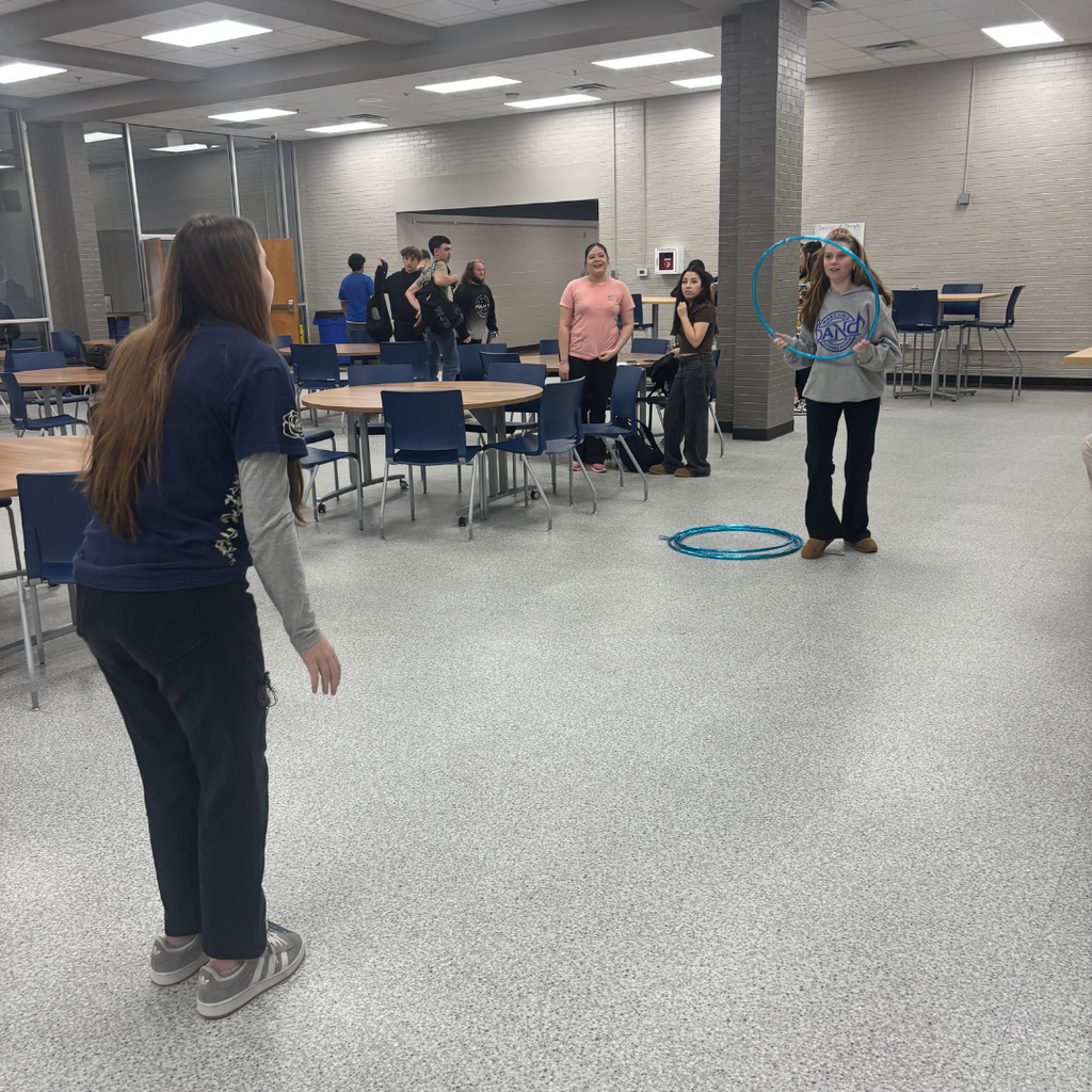 Students competing in Hula Hoop Toss for Homeroom March Madness Games