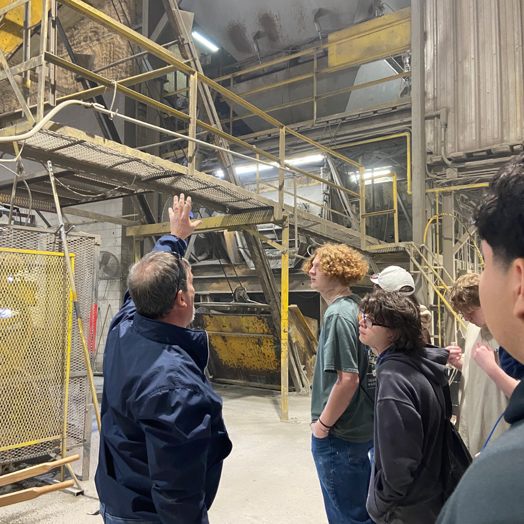 CTAE students touring inside of masonry factory on field trip.