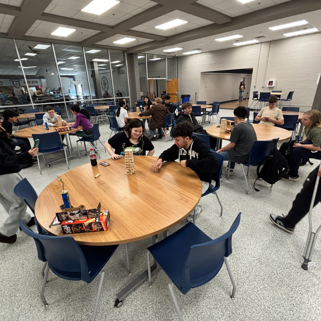 Two representatives from each grade level playing Jenga for the top spot for each grade level