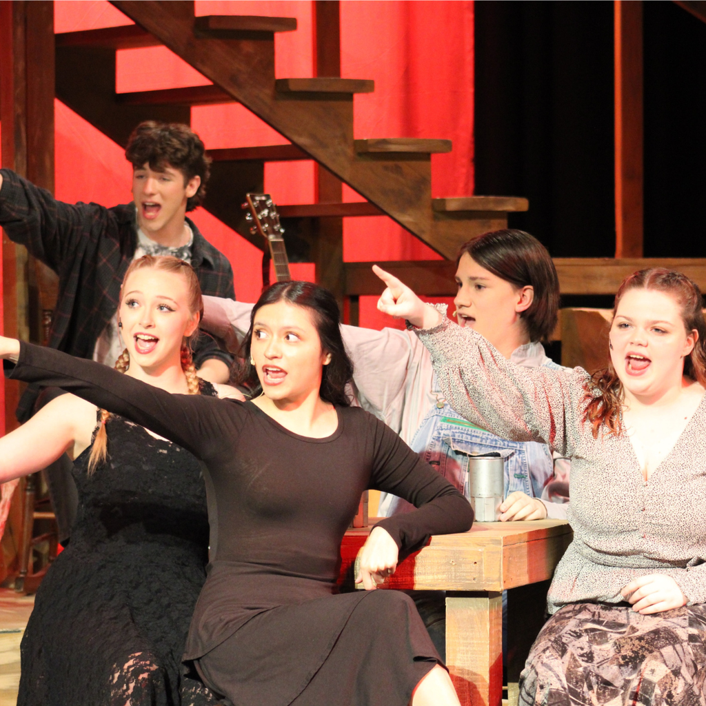Student performing in Hadestown Spring Musical
