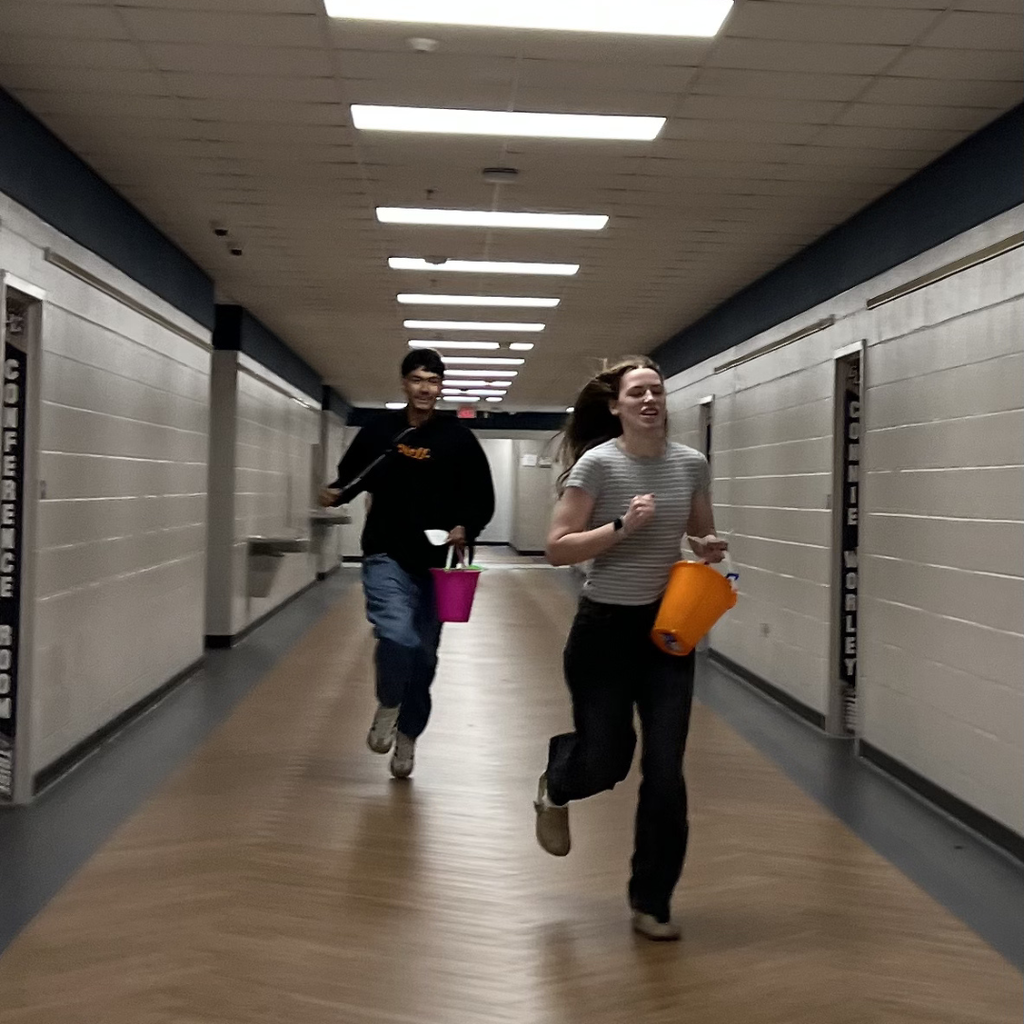 Grade level reps running to the next location on the scavenger hunt