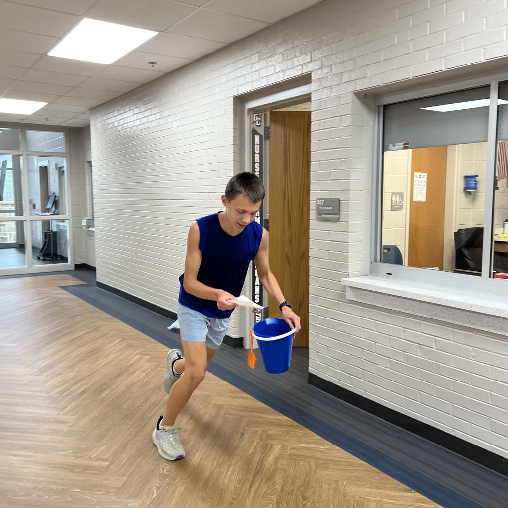 Student hurrying after picking up scavenger hunt item from the school nurse