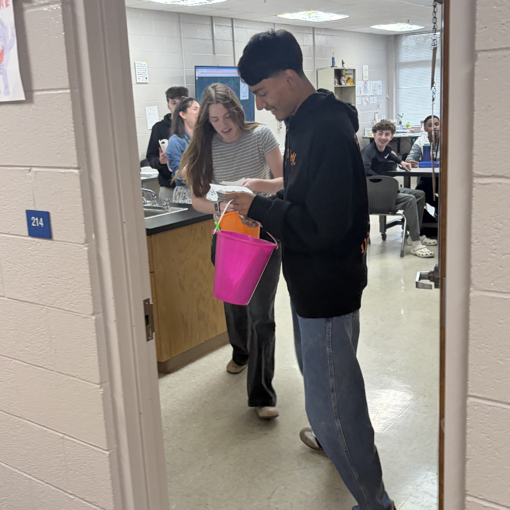 Homeroom reps picking up items from the science classroom that was on the scavenger hunt