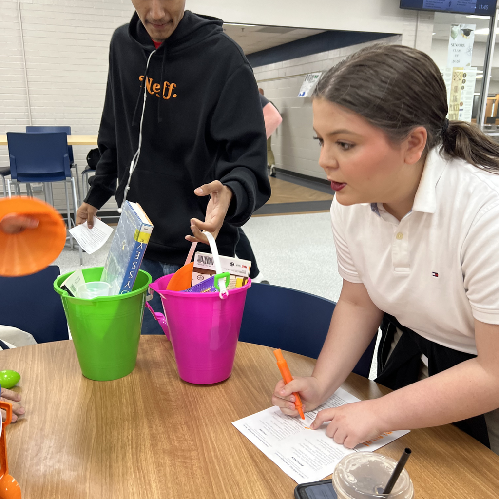 NHS member checking off scavenger hunt bucket items