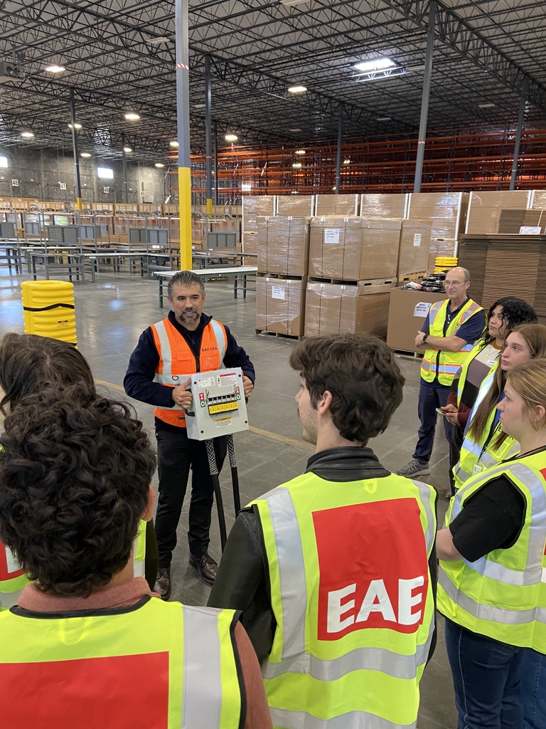 Plant supervisor showing students products