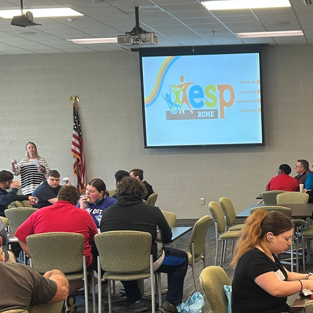 Picture of students, parents and teachers at GA CTI Transition Fair with presenter