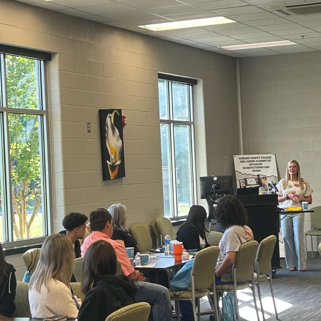 Picture of students, parents and teachers at GA CTI Transition Fair with presenter