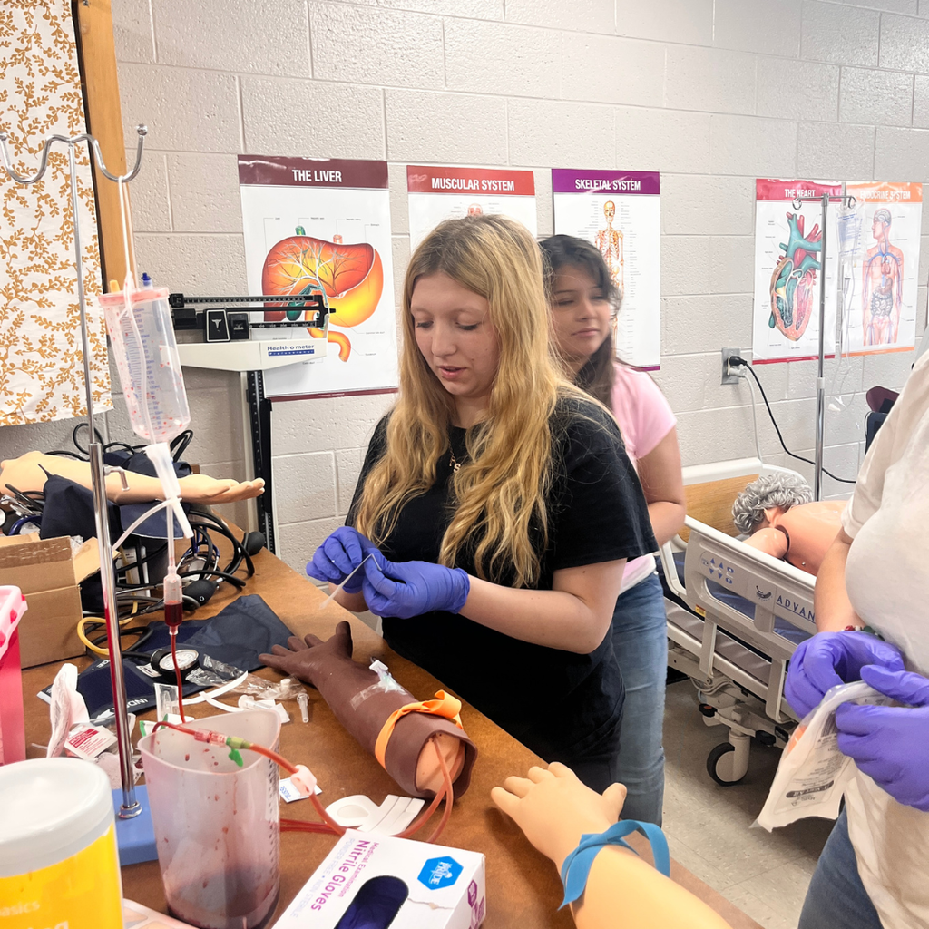 Allied Health student learning to do IV insertion
