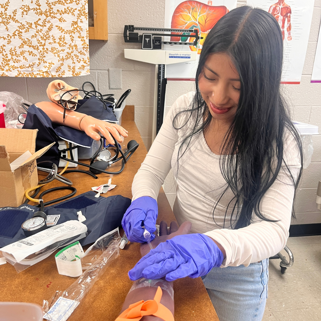 Allied Health student learning to do IV insertion