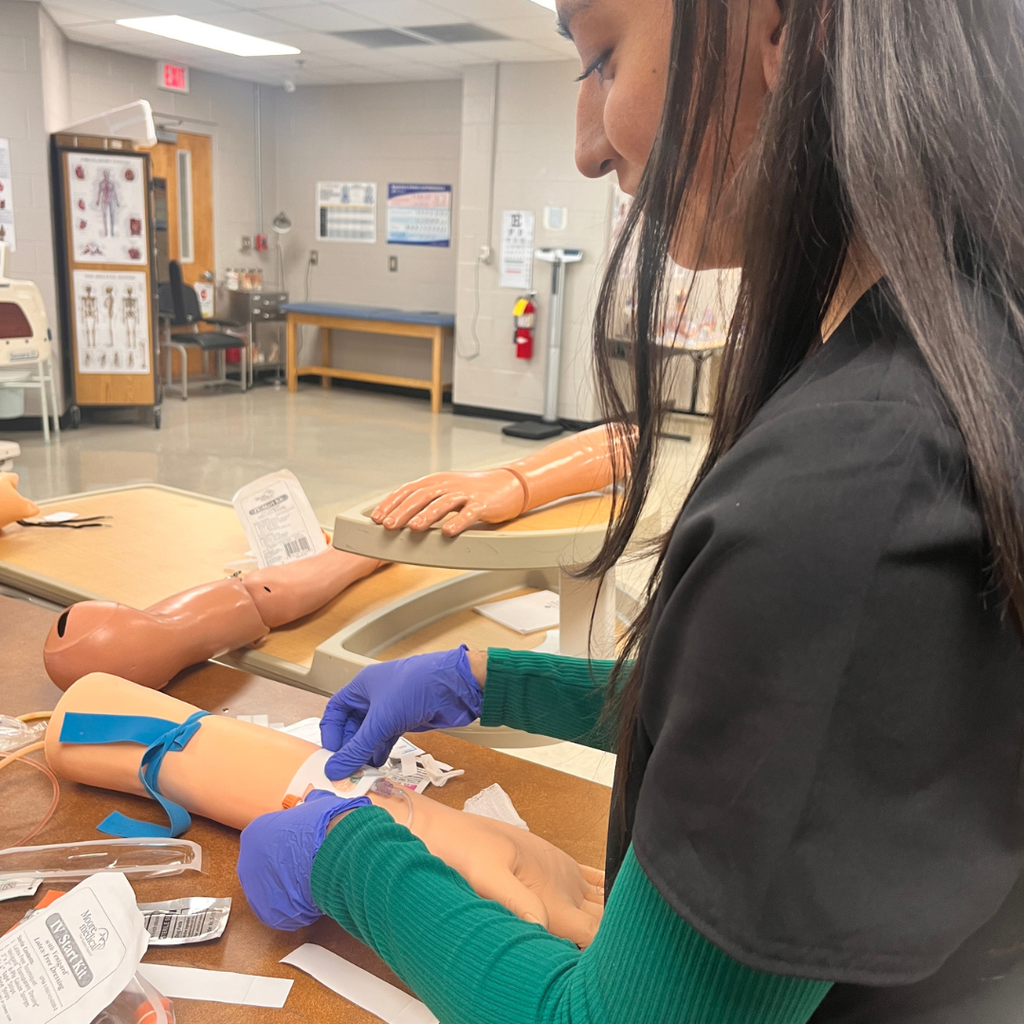 Allied Health student learning to do IV insertion