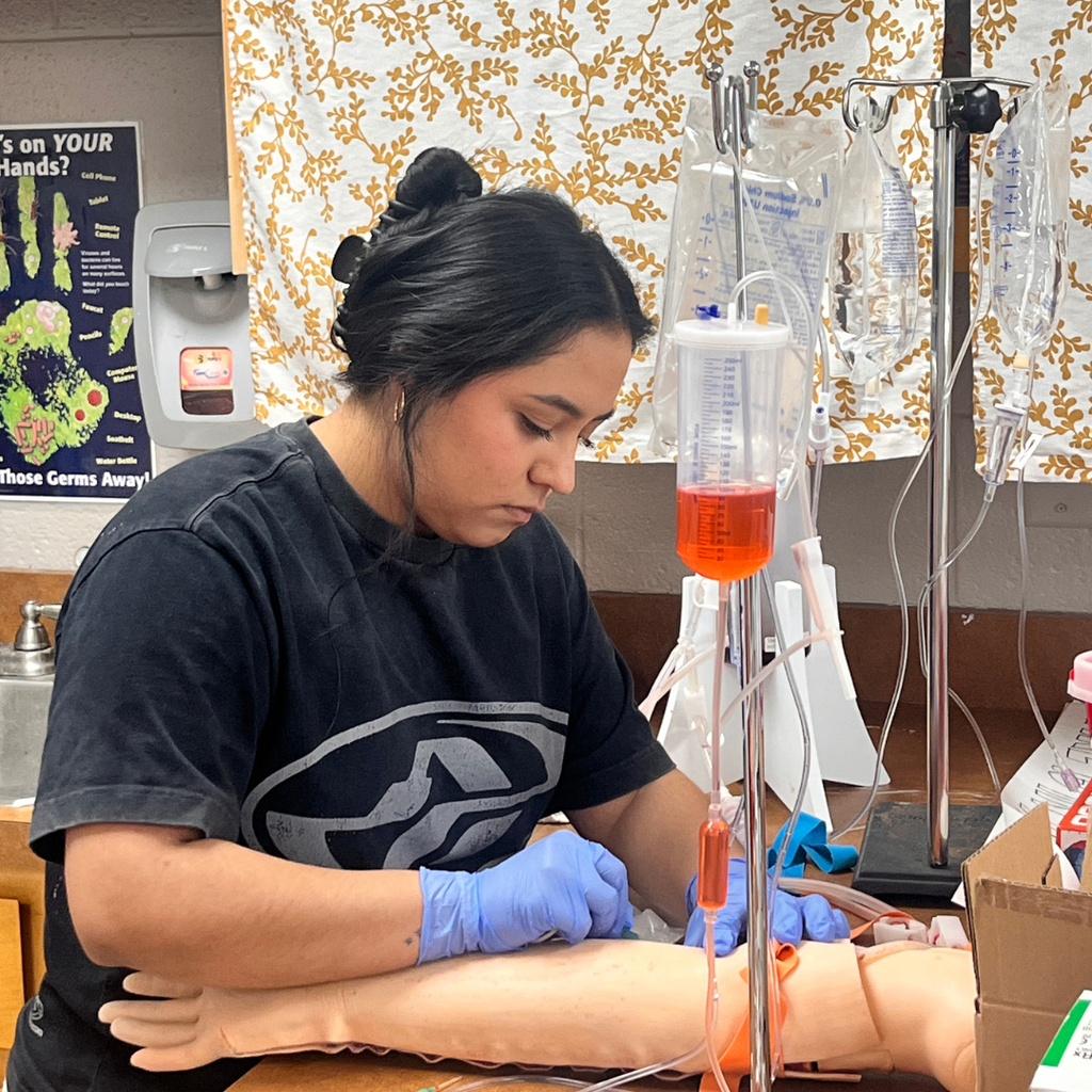 Allied Health student learning to do IV insertion