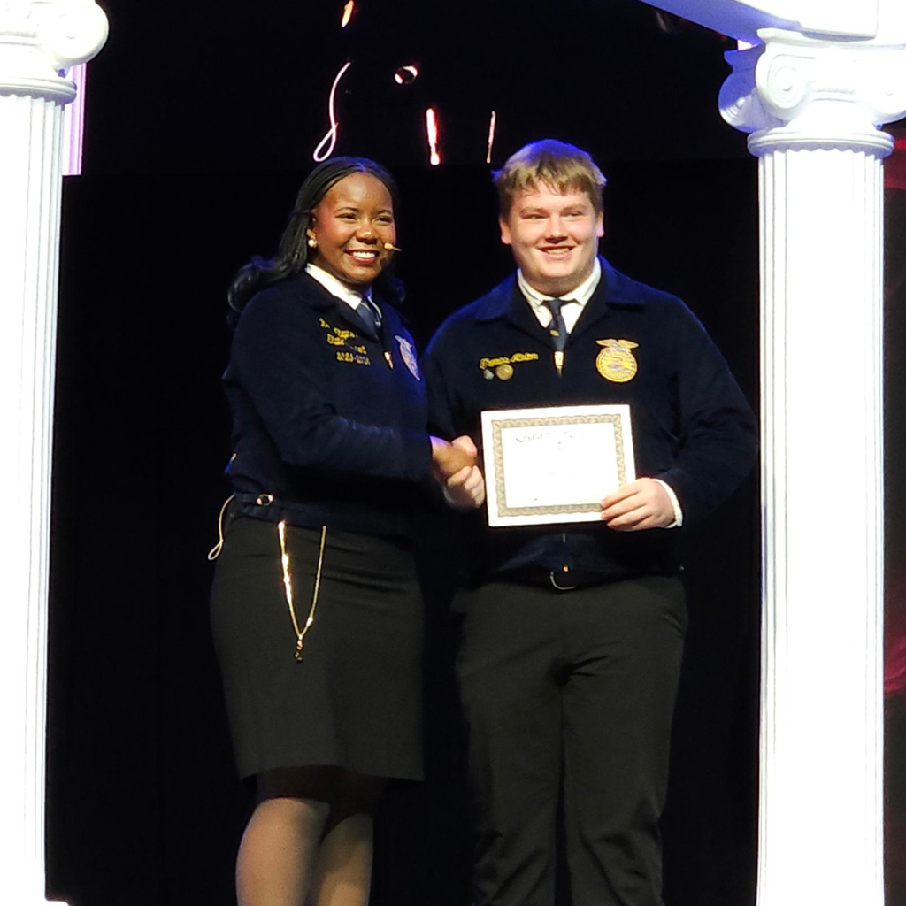 Thomas Minton receiving his state FFA degree at the state FFA convention