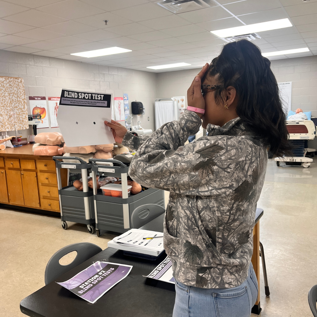 Student in Essentials of Healthcare doing lab stations for the nervous system