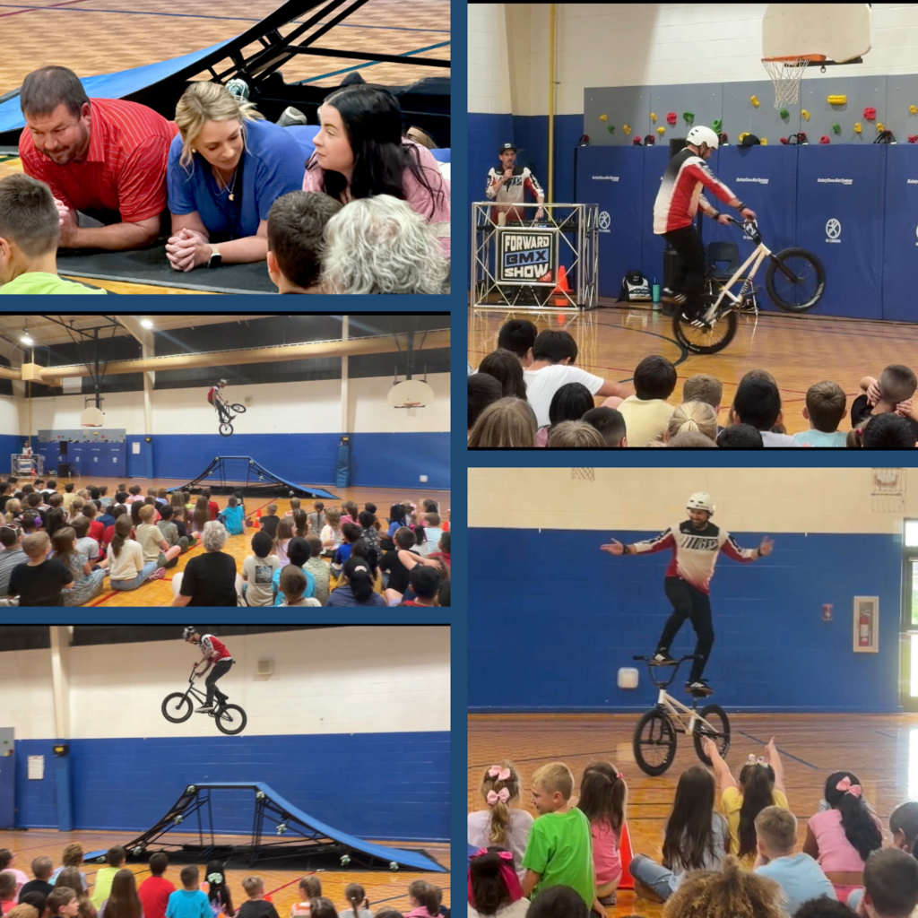 BMX pep rally with bike tricks as students watch and cheer